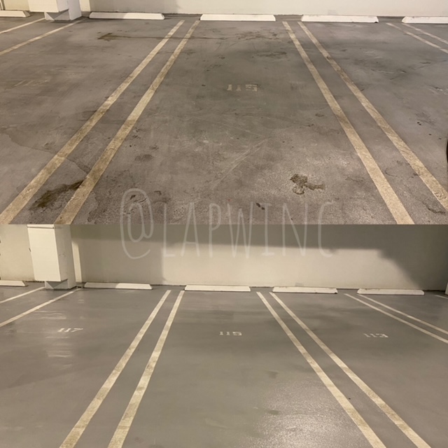 before and after of parking garage pressure washed