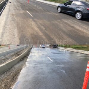 Pressure washed before and after asphalt